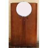 An Art Deco limed oak three piece bedroom suite, comprising two door wardrobe,