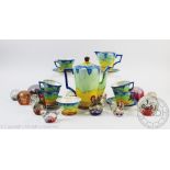 A Hancocks Art Deco forteen piece coffee service (at fault) with twelve glass paperweights,