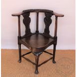 A 19th century carved oak corner chair / desk chair, in 18th century style,