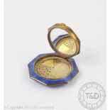 An Art Deco enamelled powder compact, of octagonal form and enamelled in blue,