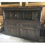 A 17th century and later carved oak court cupboard,