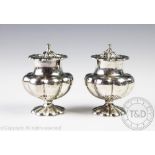 A pair of Victorian silver pepperettes, London 1842, possibly modelled as pumpkins,