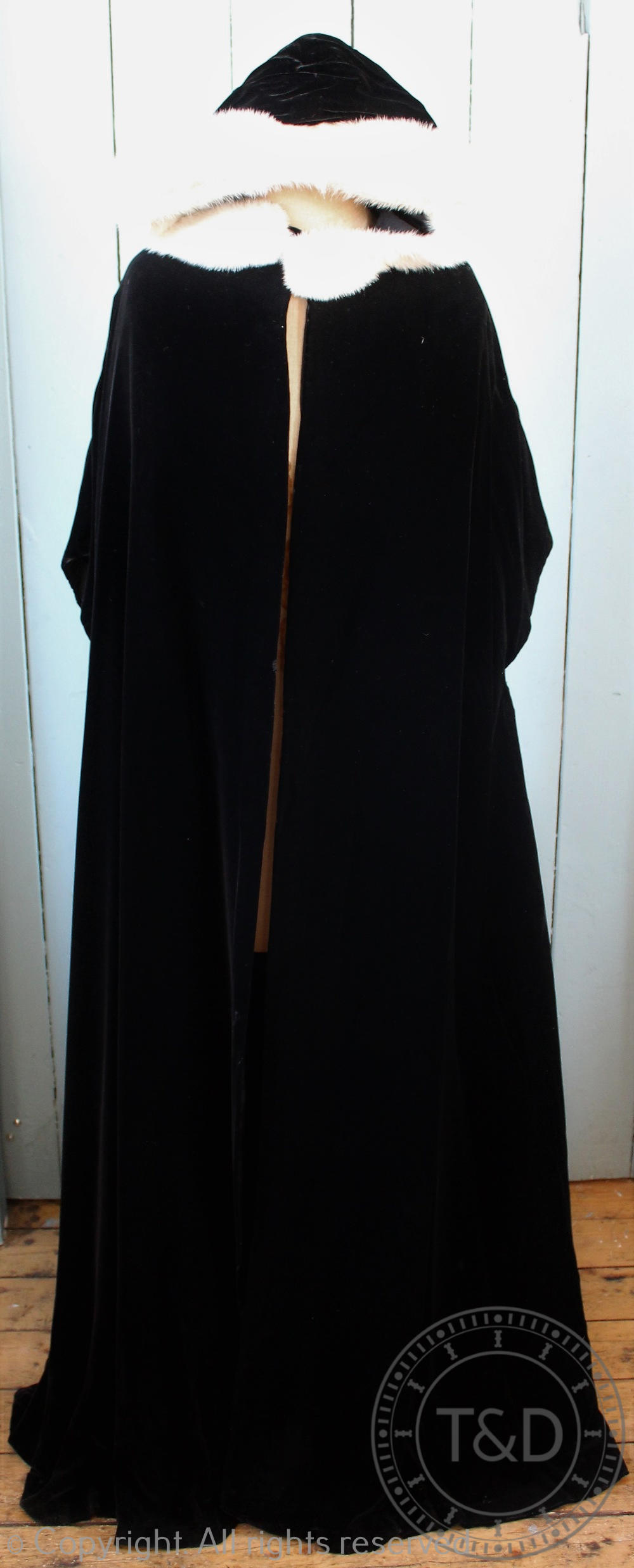 A 20th century ladies black velvet full length cape with mink trim hood,