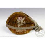 A 19th century Rugby cap - Yorkshire or Lancashire, decorated with a rose and dated 1888-9,
