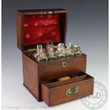 An early 19th century mahogany apothecary cabinet, with recessed brass handles,