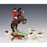 A Beswick part hunting set comprising; a rearing hunter and huntsman model No.