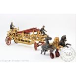 A continental cast metal model of a vintage fire engine, possibly German, modelled with three hoses,