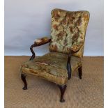 A George III style mahogany library chair, early 20th century, with floral upholstered back,