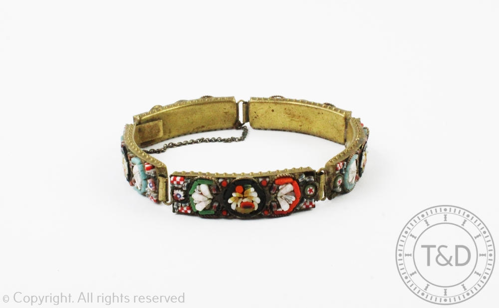 A micro mosaic bracelet, designed as five panels of floral motifs in gilt metal,