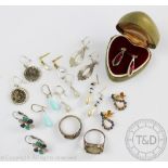 An assorted collection of earrings, to include silver,