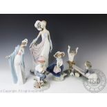 A Lladro see-saw figural group, 19,5cm high with two further Lladro figures No.5222 and No.