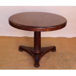 An early Victorian mahogany circular centre table / library table,