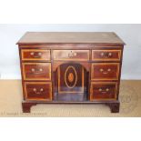 An Edwardian Sheraton style inlaid mahogany library desk, in the manner of Edwards and Roberts,