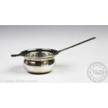 A silver tea strainer, Wakely & Wheeler, London 1949,