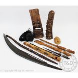 A selection of tribal items, to include and Australian Aboriginal boomerang, 72cm, a club and pipe,