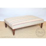 A Victorian style salon foot stool of large proportions, with striped upholstery,
