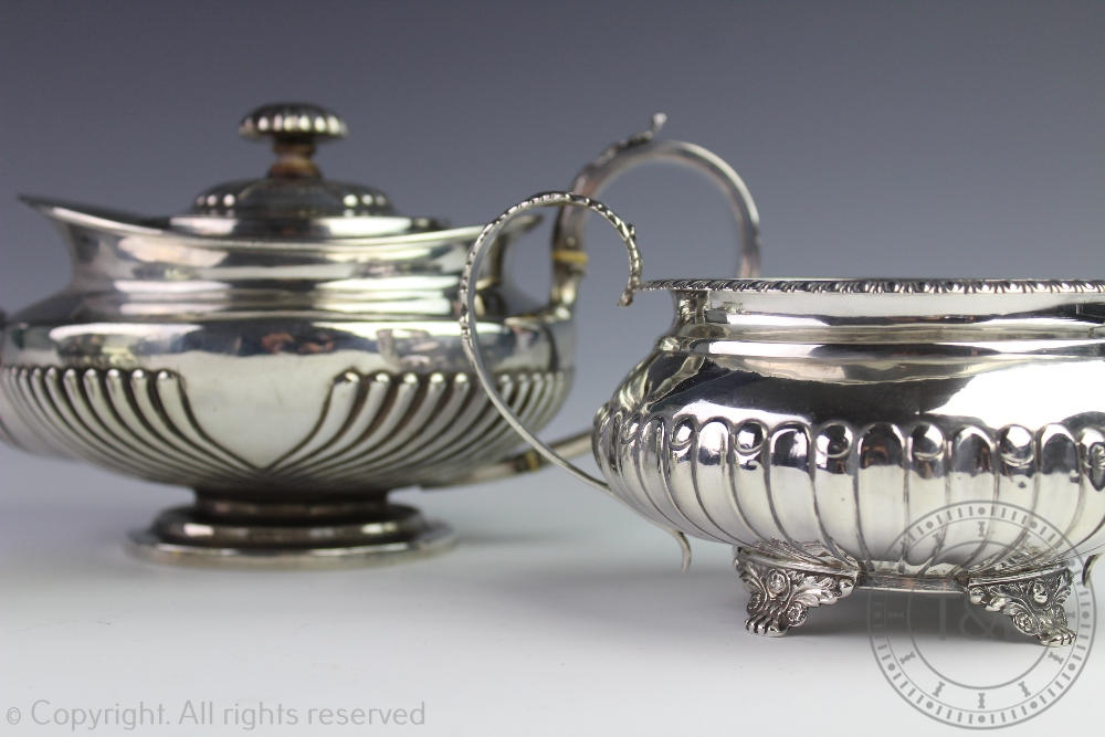 An assembled three piece silver tea service, each piece of low rounded form, with fluted detail, - Image 2 of 3