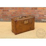 A vintage leather suitcase 'Orient Make', early 20th century, with travel labels,