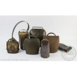 A collection of six Swiss cow bells including a large example stamped 'Chamonix',