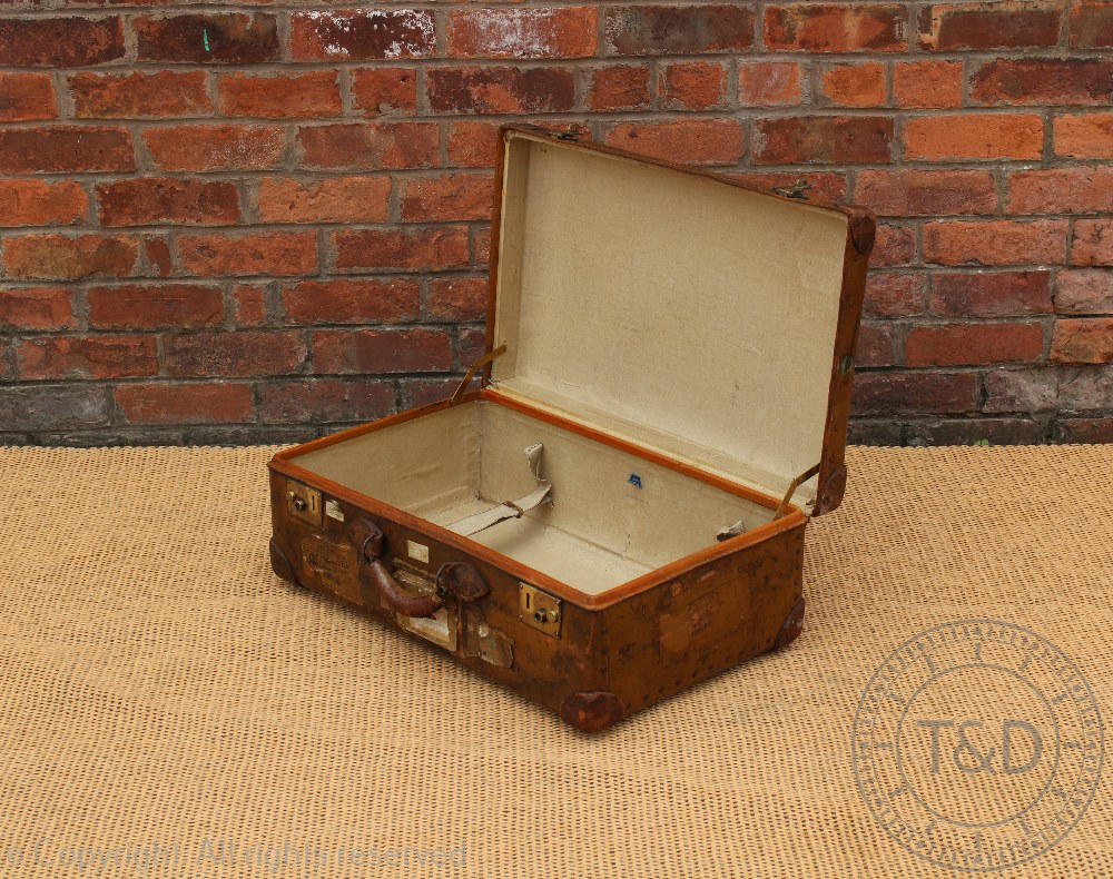 A vintage leather suitcase 'Orient Make', early 20th century, with travel labels, - Image 4 of 4