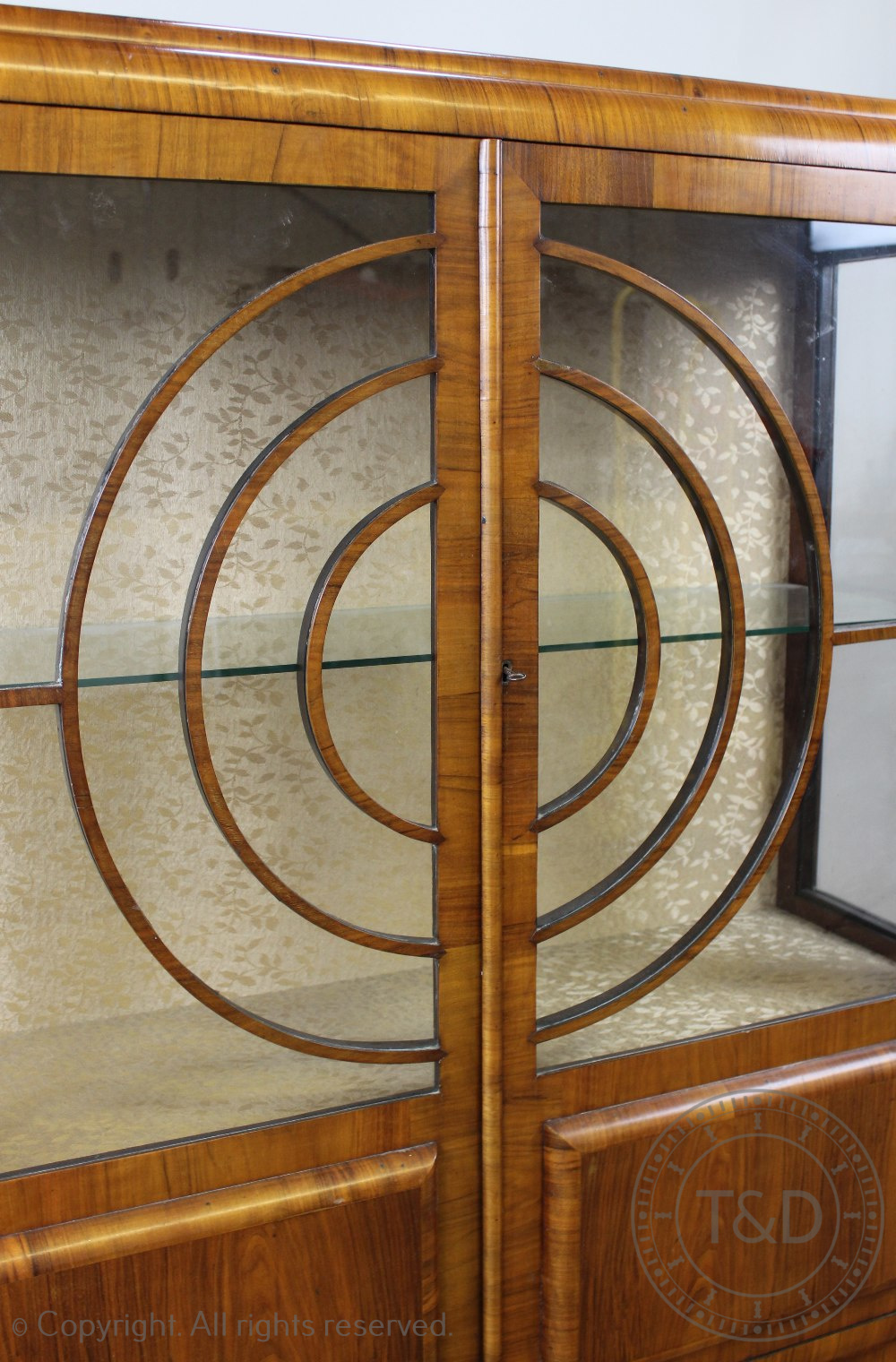 An Art Deco walnut display cabinet, with two glazed doors forming concentric circles, - Image 2 of 3