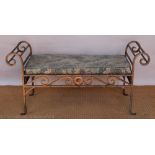 An Art Deco style wrought iron garden bench, with scroll ends,