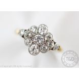 A diamond set daisy cluster ring,