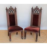 A pair of Victorian carved oak Gothic chairs, of ecclesiastical style,