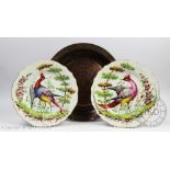 A pair of 19th century pearlware plates painted with ho-ho birds in the manner of James Giles