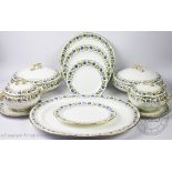 A Caulden china dinner service retailed my Mortlocks Ltd London each piece decorated with a border