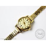 A ladies Marvin Automatic wristwatch, the champagne dial with batons,