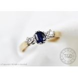 A diamond and sapphire three stone ring,