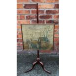 A 19th century mahogany pole screen, on tripod base,