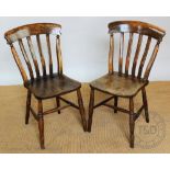A set of four late Victorian beech country kitchen chairs, with solid seats, on turned legs,