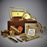Property of a Lady A magnificent cased gold dressing set by Cartier and Goldsmiths and Silversmiths