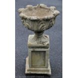 A reconstituted stone garden planter on stand,
