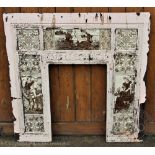 A late 19th century Aesthetic cast iron fire surround, set with fourteen printed tiles,