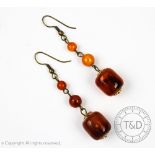 A pair of amber set drop earrings,