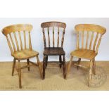 A harlequin set of twelve Victorian and reproduction pine kitchen chairs (12)