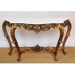 An 18th century style giltwood and gesso serpentine console table,