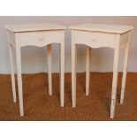 A pair of white painted bedside tables,