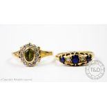 A peridot and diamond set oval cluster ring,
