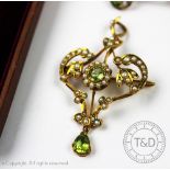 A late 19th/early 20th century peridot and seed pearl set pendant and brooch,