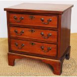 A George III style small mahogany chest, of three long drawers, on bracket feet,