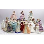 An assorted collection of figurines, to include; seven Wedgwood commissioned by Spink ladies,