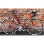 A Claude butler gentlemans bicycle, with red livery and black leather seat,