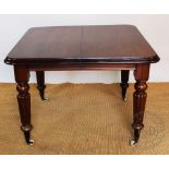 A 19th century and later mahogany extending dining table, with two spare leaves,
