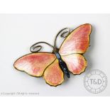 Marius Hammer: A Norwegian silver and enamelled butterfly brooch, pink basse taille enamel wings,