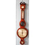 An early 19th century mahogany wheel barometer, with three silvered dials, mirror and thermometer,