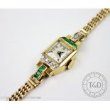 An Art Deco ladies cocktail watch set with diamonds and emeralds,